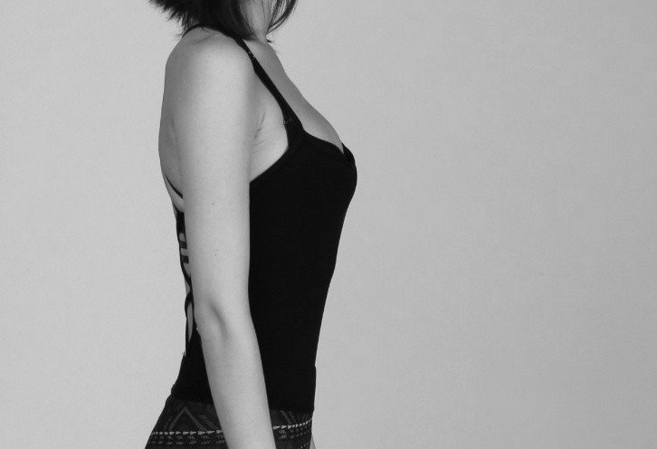 Side profile of a female who has good posture.