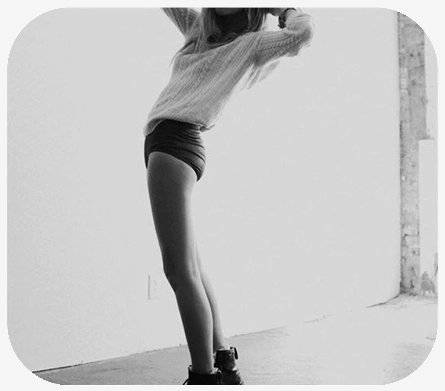 Female leaning backwards and tilting towards the camera