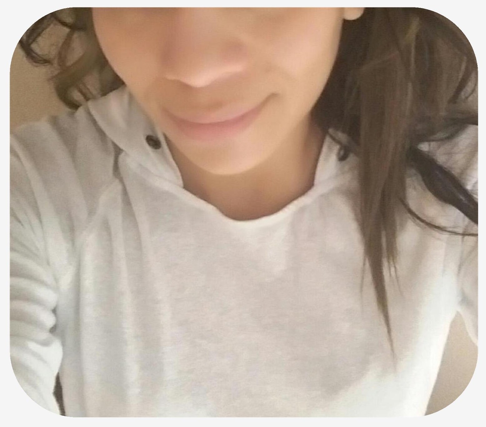 Woman laying on bed highlighting the smooth complexion of her face