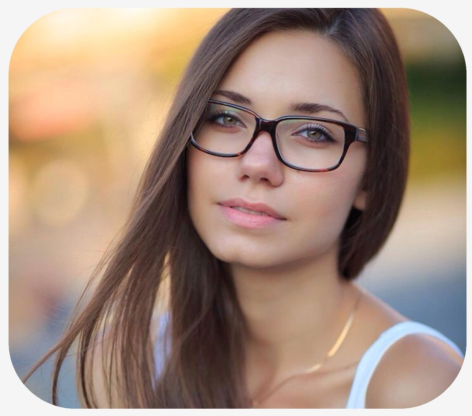 Female wearing eyeglasses with her hair blowing in the wind