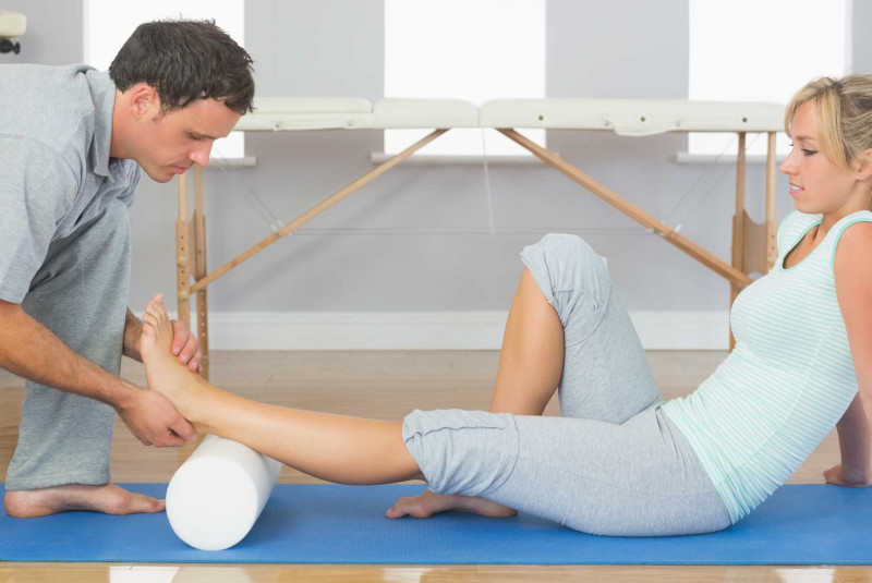 Man stretching a woman for her
